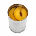 Консервированные / консервированные половинки / кубики / ломтики желтого персика в легком сиропе или в густом сиропе в жестяной упаковке или в стеклянной банке